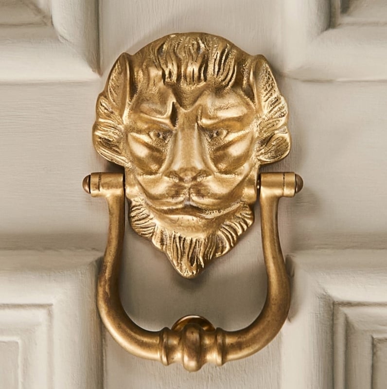 Door Knocker, Aged Brass Lion's Head with Sculptural Detail.