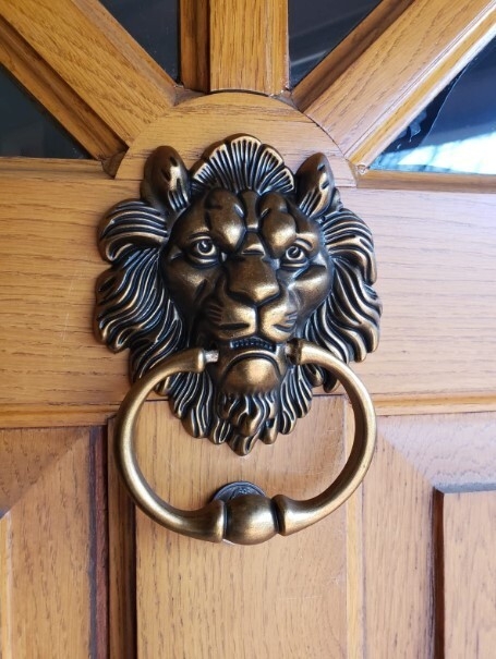 Door Knocker, Antique Bronze Lion Head with Sculptural Detail.