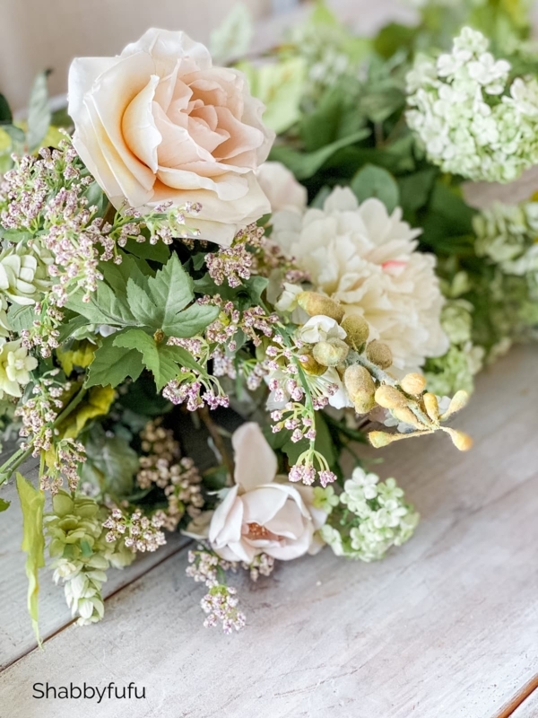 Faux Floral Arrangement Fuzzy Buds Layered Petals on Weathered Wood