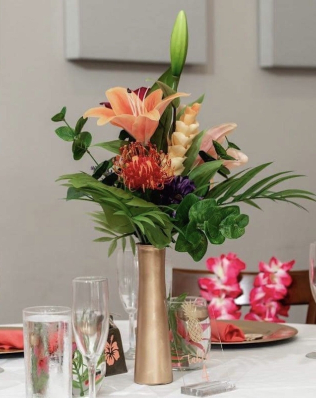 Floral Centerpiece Mixed Tropical Textures in Slender Gold Vase