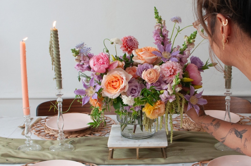 Floral Centerpiece on Marble Display Riser Ribbed Glass Vessel Pastel
