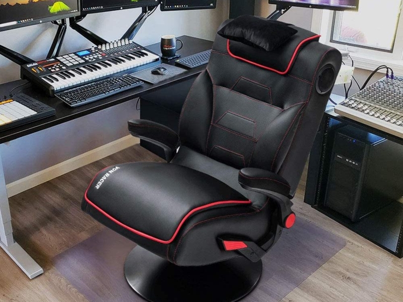 Gaming Chair: Pedestal Base, Flip-Up Arms, and Extendable Leg Rest