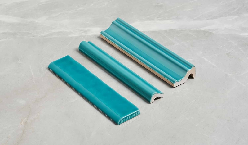 Glossy Teal Ceramic Tile Trim Pieces with Sculptural Architectural Profiles