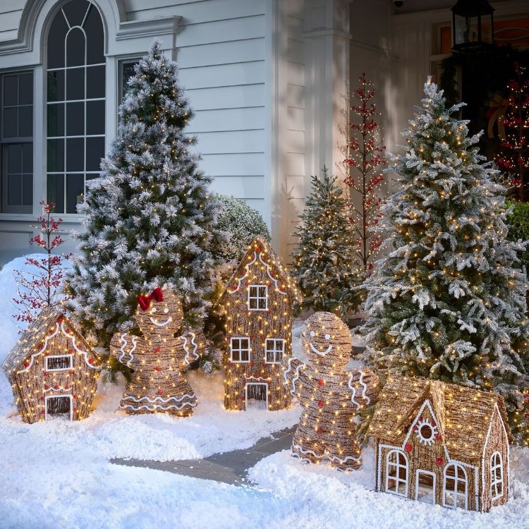 Holiday Decorations: Woven gingerbread structures, flocked trees.