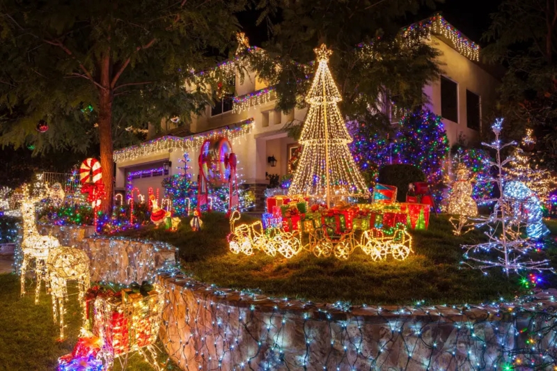 Holiday Light Display: Mixed LED temperatures, cone tree, reindeer.