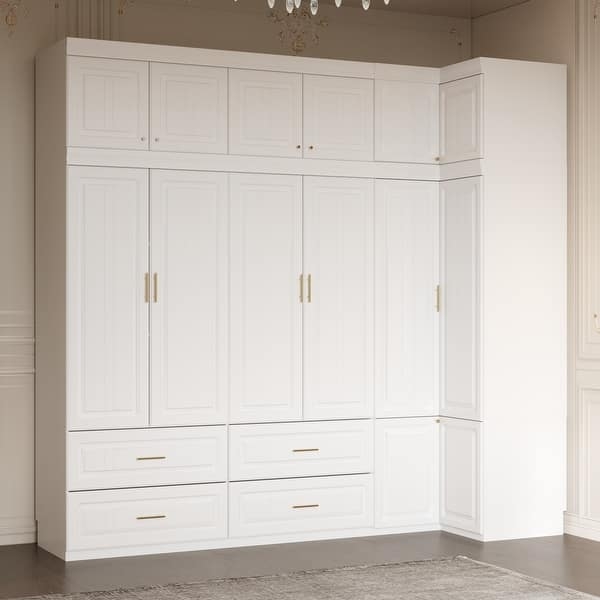L-Shaped Corner Armoire Wardrobe with White Shaker Panels and Gold Hardware.