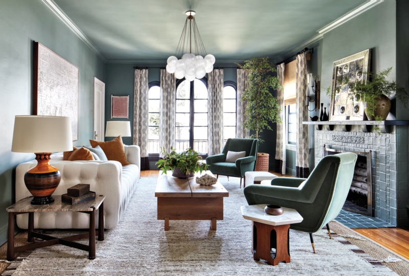 Living Room Moody Sage Monochromatic Walls Globe Lighting Tiled Fireplace