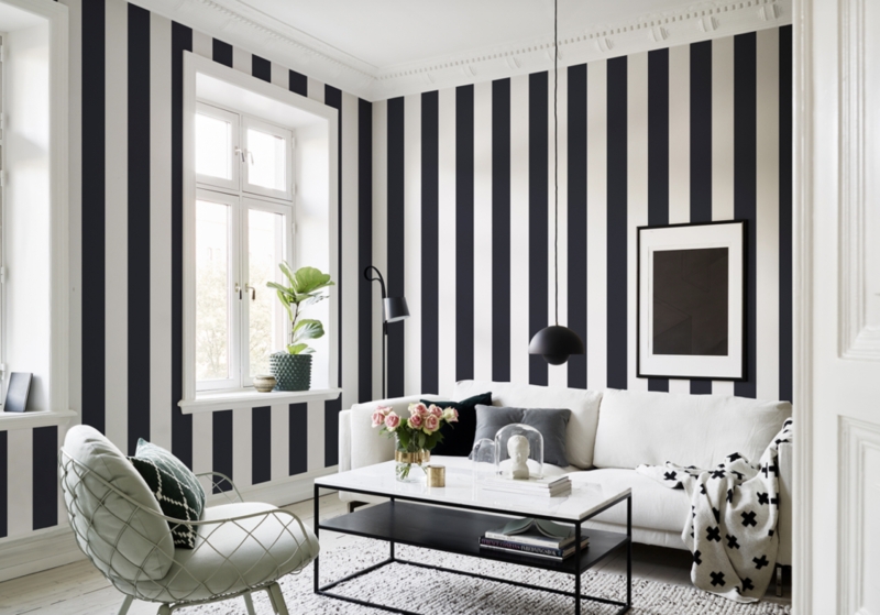 Living Room Vertical Striped Walls Marble Tiered Table Wireframe Chair