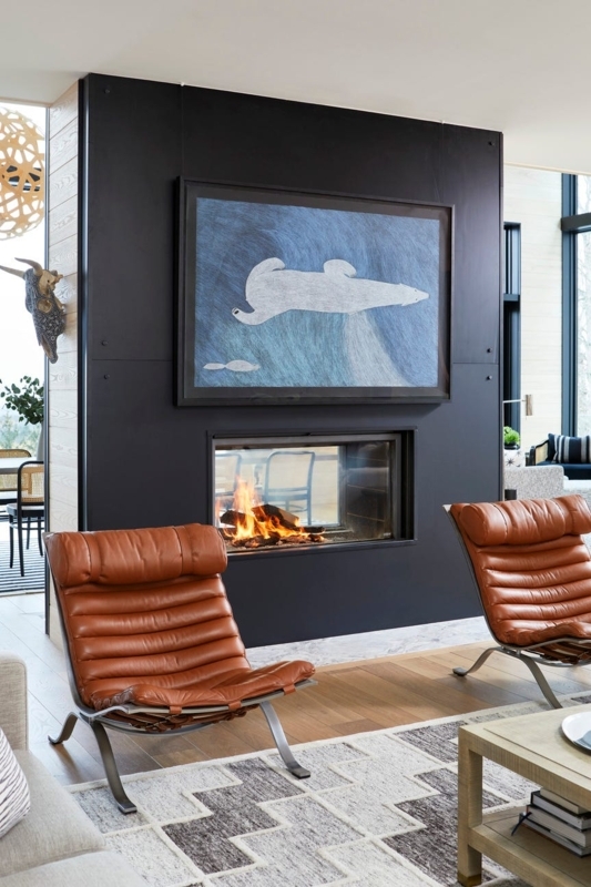 Matte Black Partition Wall featuring See-Through Fireplace