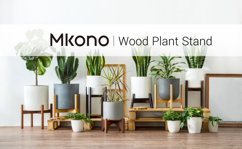 Mid-Century Wood Plant Stand with Crossbar Base and Tapered Legs.