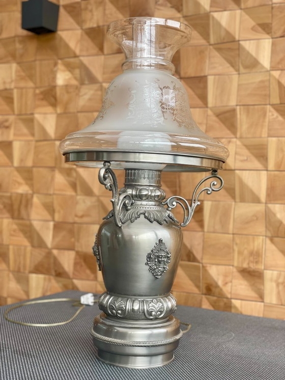 Ornate Hurricane Lamp with Embossed Mask Medallion