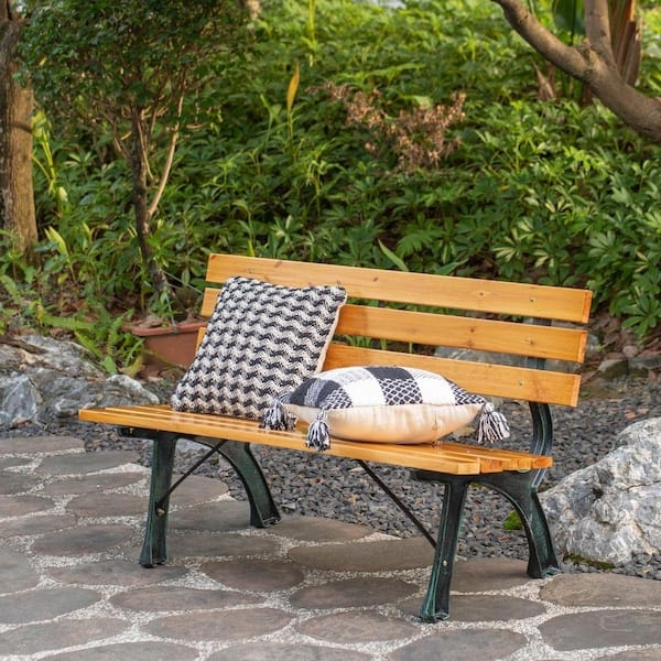 Outdoor Bench with Ornate Metal Frame and Honey Wood Slat Backrest