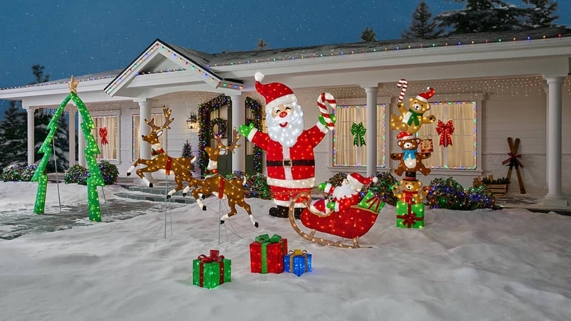 Outdoor Christmas Decor: Mesh fabric, giant Santa, leaping reindeer.