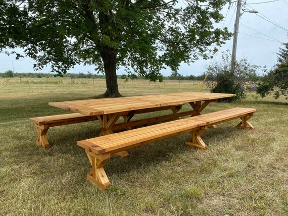 Outdoor Dining Set with X-Frame Base and Matching Benches