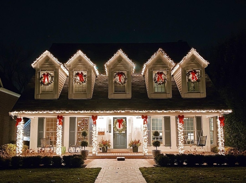 Outdoor Holiday Display: Symmetrical facade, light wrapped pillars.