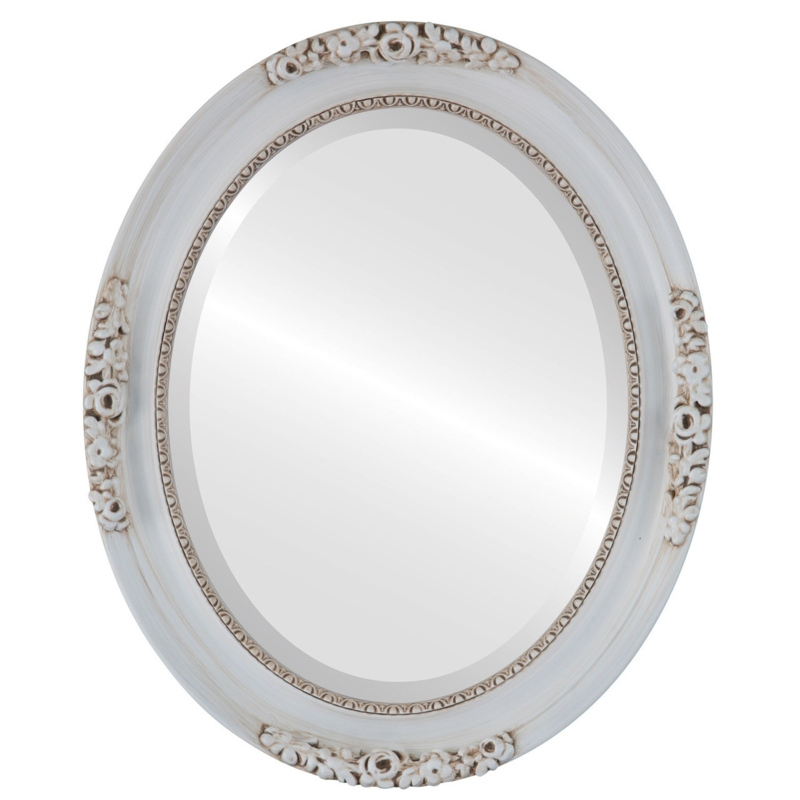 Oval Mirror featuring Intricate Floral Carvings and Beveled Edge