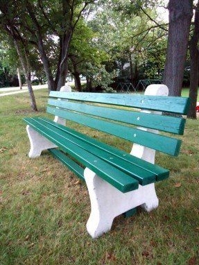 Park Bench: Green Slatted Outdoor Bench with White Concrete Legs