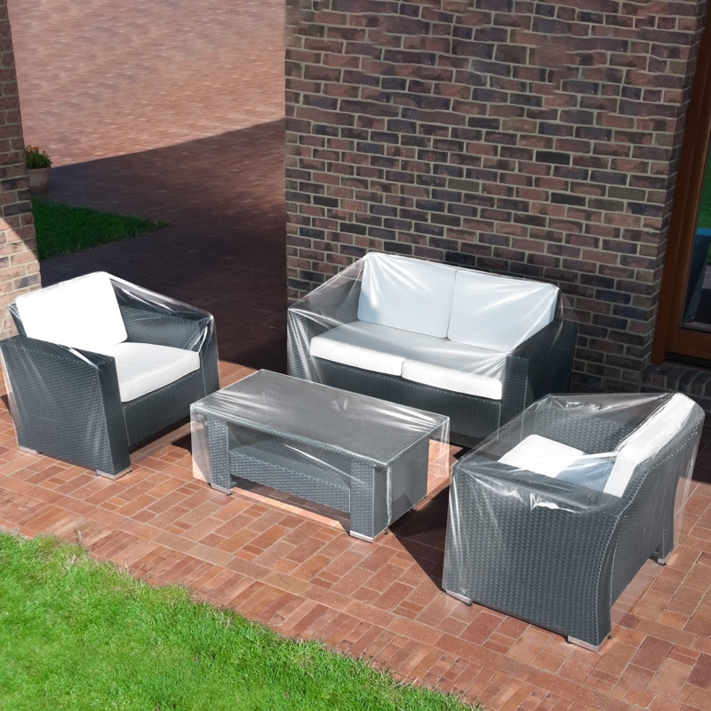 Patio Furniture Set Clear Plastic Covers over Charcoal Wicker