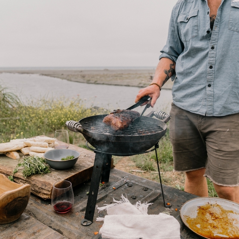 Portable Cast Iron Grill with Tripod Base and Open Basin Design
