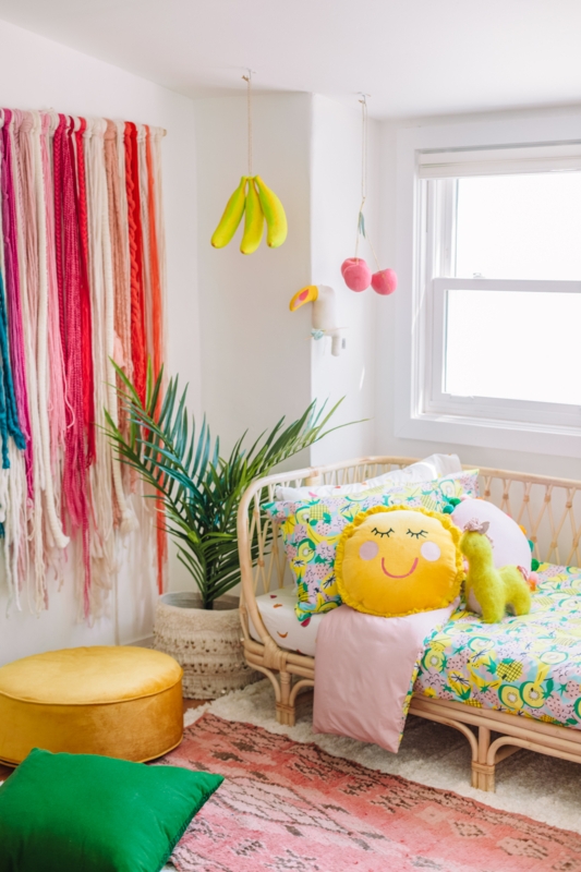 Rattan Daybed with Whimsical Decor and Sun Pillow, Boho Tropical Bedroom