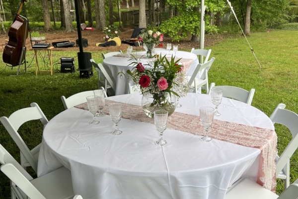 Round Banquet Tables: White Resin Garden Event Setup (55 chars)