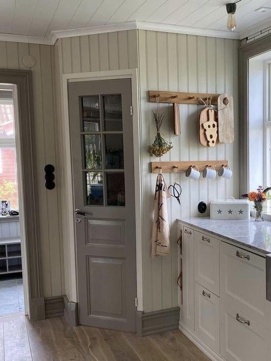 Sage Green Corner Pantry Door with Vertical Beadboard Walls