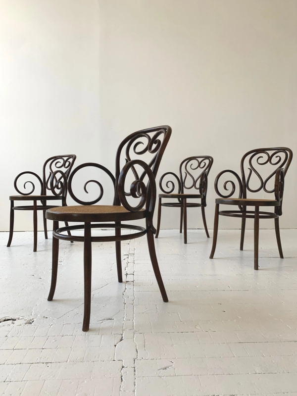 Salvatore Leone Bentwood Armchair: Ornate Scrollwork Back, Cane Seat