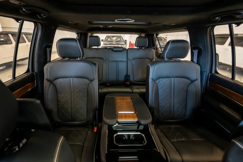 SUV Interior with Quilted Black Seats and Wood Trimmed Center Console