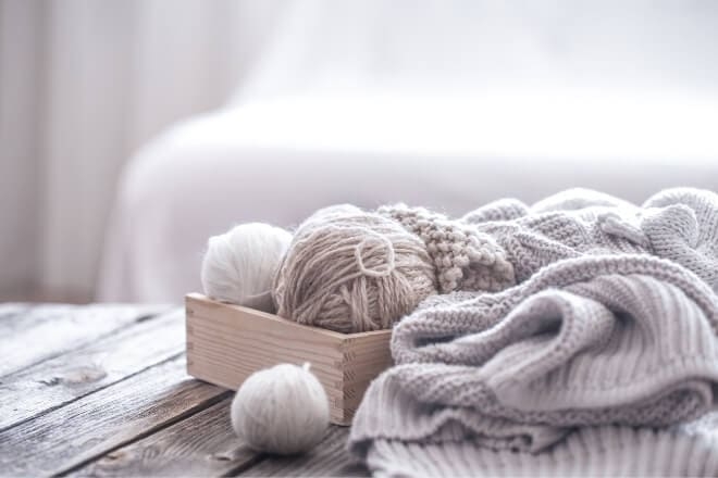 Textile Decor with Cable Knit Yarn Balls in Wooden Crate
