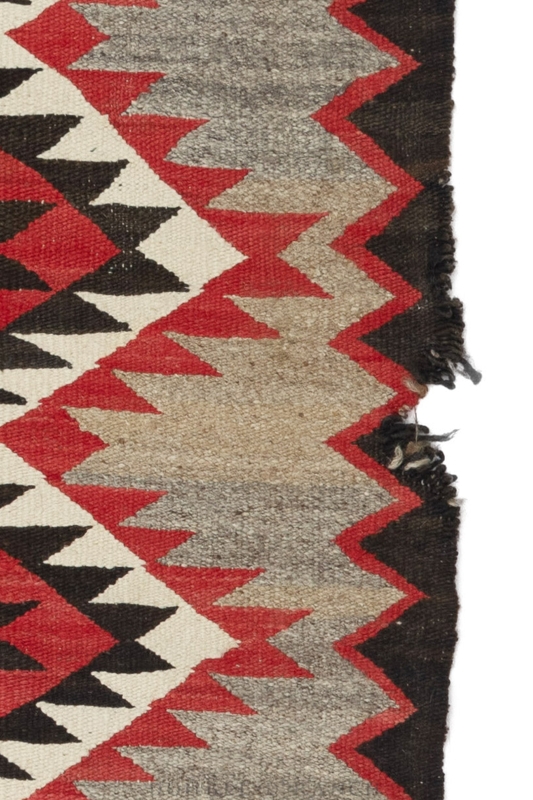 Textile Rug with Scarlet Red Serrated Pattern and Frayed Edges