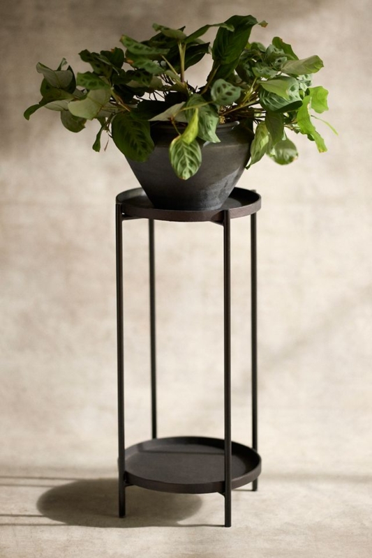 Tiered Black Plant Stand with Slim Vertical Legs and Raised Tray Rims.
