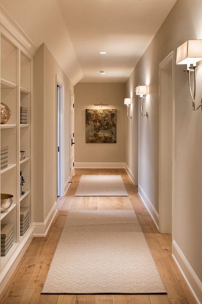 Transitional Hallway Lighting Rhythmic Sconces Chevron Runners Warm Beige