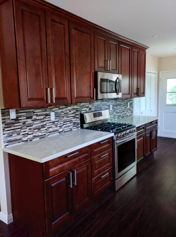 Transitional Kitchen Cabinets with Linear Mosaic Tile Backsplash
