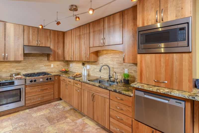 Transitional Wood Cabinetry with Stone Tile Kitchen Backsplash