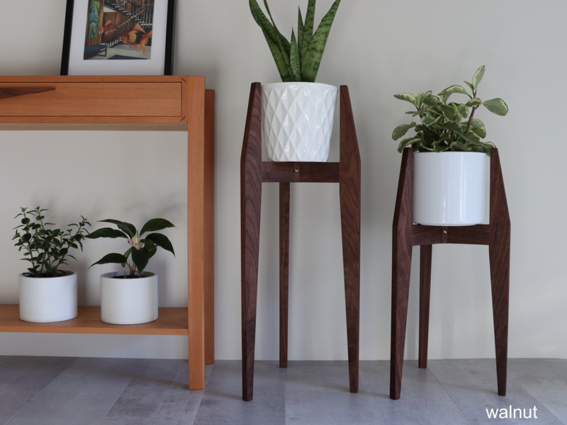 Walnut Wood Plant Riser Set with Staggered Heights and Tapered Legs.