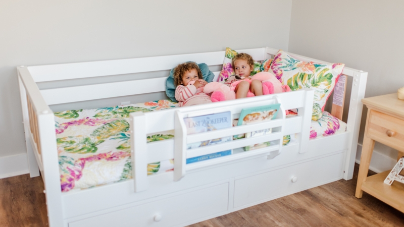 White Toddler Daybed with Integrated Book Rack and Storage Drawers