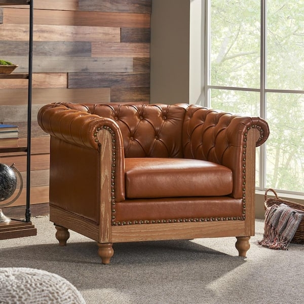 Accent Chair: Cognac Tufted Leather, Exposed Wood Base. Chesterfield Style.