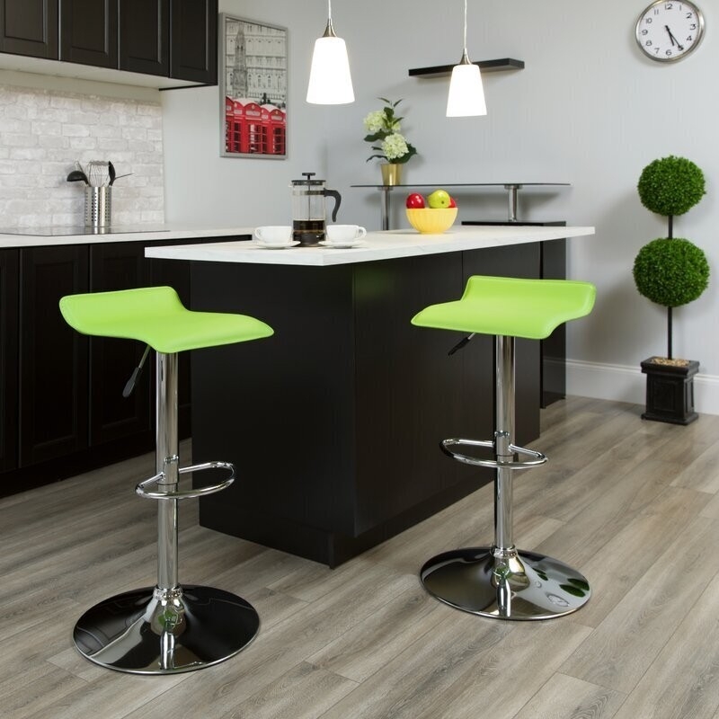 Bar Stool with synthetic low profile seat on a polished chrome pedestal.