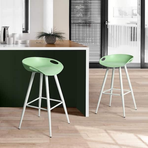 Bar Stool with white metal legs and lime green plastic cutout seat.