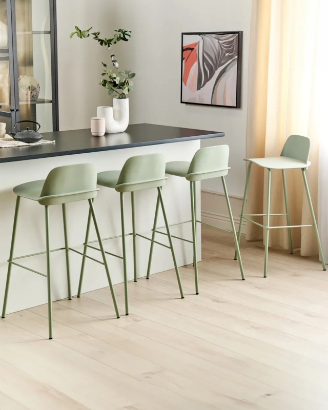 Bar Stools in sage green metal with slim profile and low backrest.