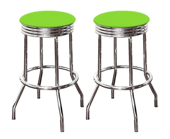 Bar Stools with ribbed chrome apron, round seat, and flared legs.