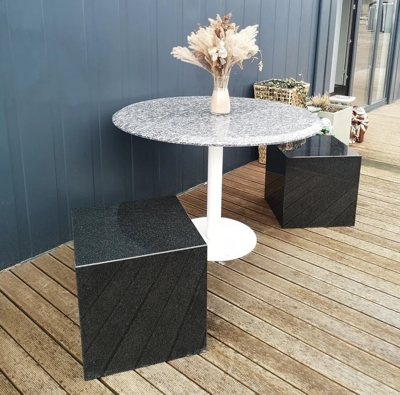 Bistro Set: Cubic Stone Seating, White Pedestal Base, Modern Minimalist.