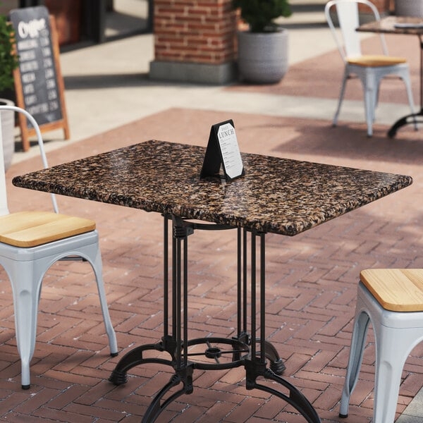 Bistro Table: Tan Brown Speckled Granite Top, Ornate Metal Pedestal Base.