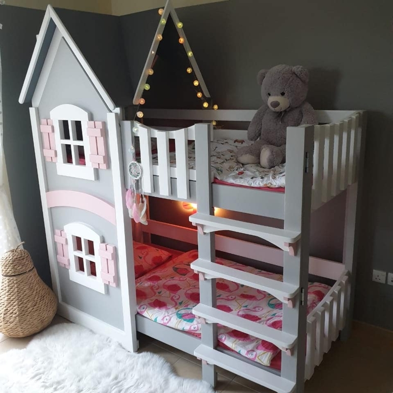 Bunk Bed Featuring Cottage Facade and Picket Rail