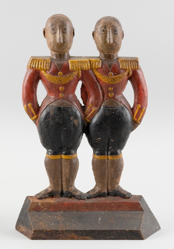 Cast Iron Doorstop Twin Figures Numerical Markings Brick Red