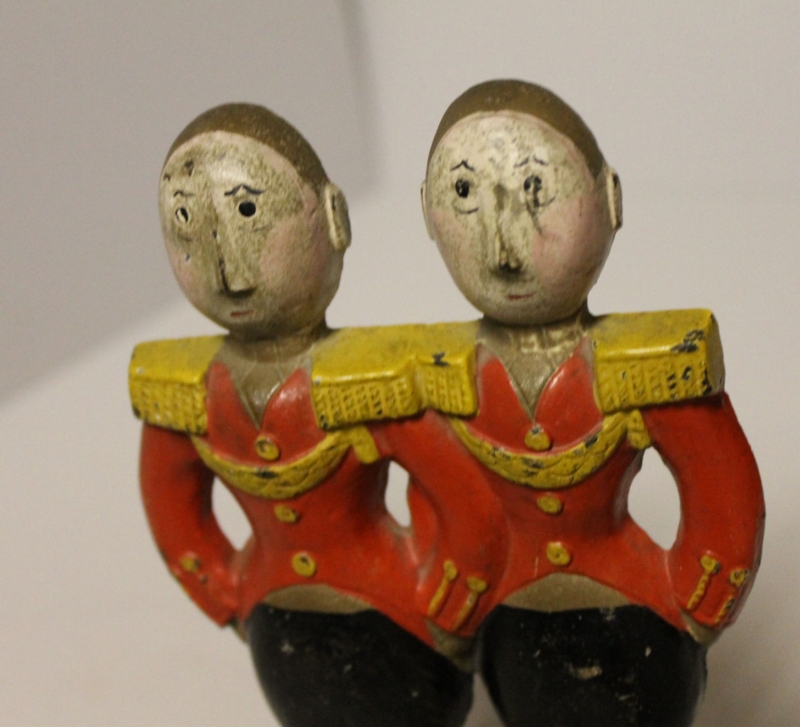 Cast Metal Door Stop Twin Soldier Motif Hands On Hips Pose