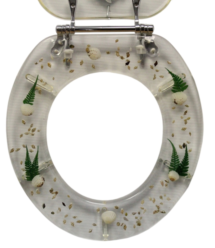 Clear Shell Toilet Seat: Polyresin Lid with Embedded Fern Leaves.