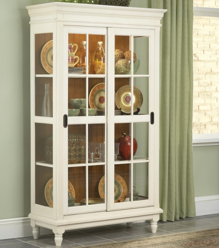 Cottage Style Storage Cabinet with Sliding Glass Doors and Turned Feet