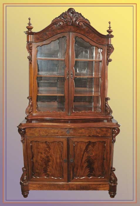 Curio Cabinet with Flame Mahogany Grain and Ornate Carved Crest