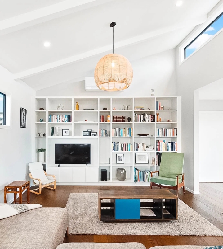 Custom Wall Unit: Floor to Ceiling Shelving in Vaulted Living Room